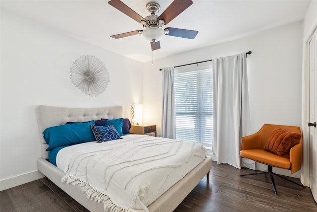 bedroom featuring ceiling fan and dark wood-type flooring