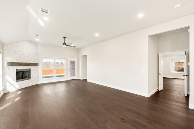 unfurnished living room featuring dark hardwood / wood-style flooring, a fireplace, lofted ceiling, and ceiling fan