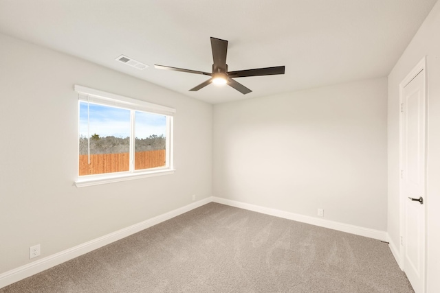 carpeted empty room with ceiling fan