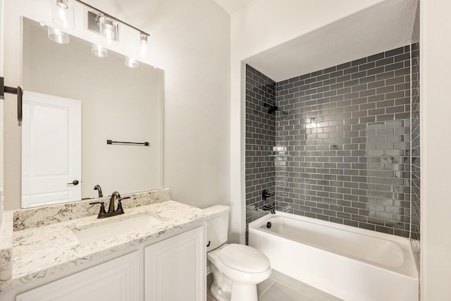 full bathroom featuring tiled shower / bath combo, vanity, and toilet