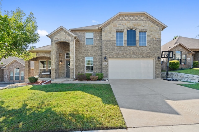 view of front of home featuring a garage and a front lawn