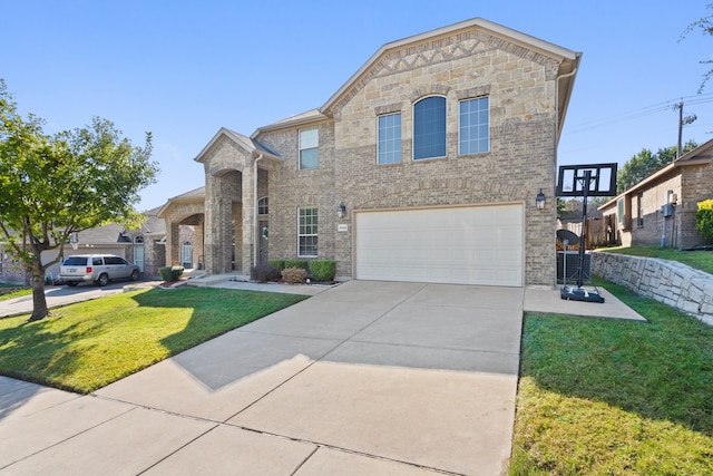 view of front of house featuring a front yard and a garage