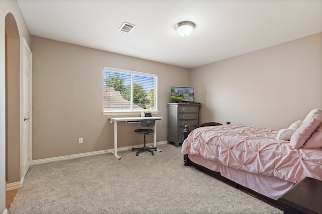 bedroom with light carpet