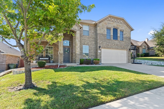 view of front of property featuring a front lawn and a garage