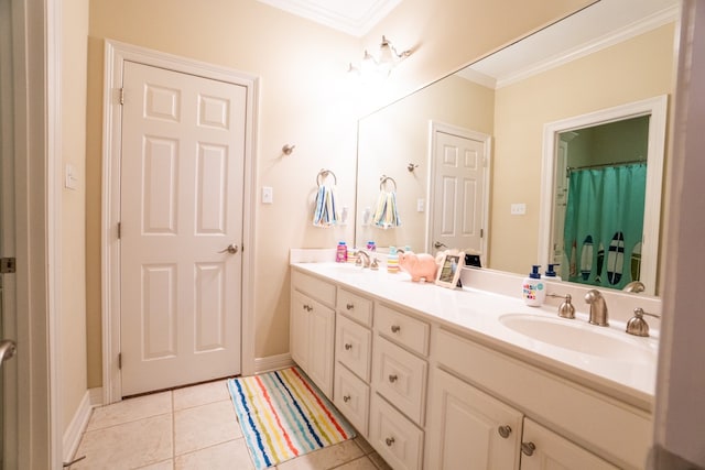 bathroom featuring ornamental molding, tile patterned flooring, and vanity