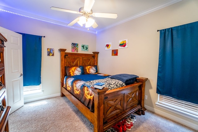 bedroom featuring light carpet, ceiling fan, and crown molding