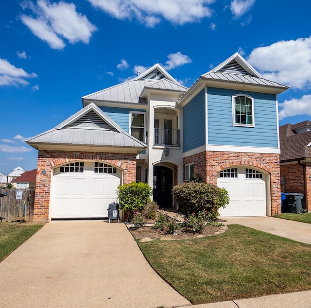 view of front of house featuring a balcony, a front lawn, and a garage