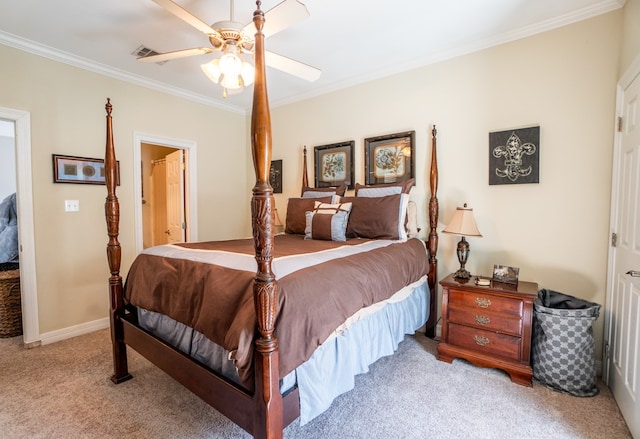 carpeted bedroom with ornamental molding and ceiling fan