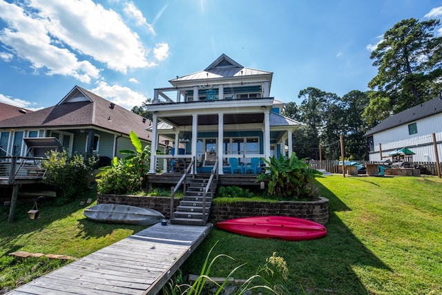 view of front of house featuring a porch and a front lawn