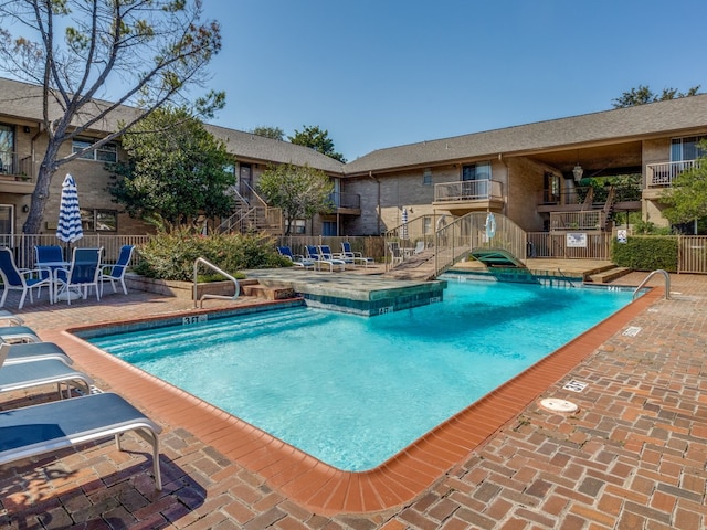 view of pool featuring a patio