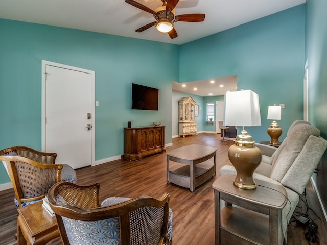 sitting room featuring ceiling fan and dark hardwood / wood-style flooring