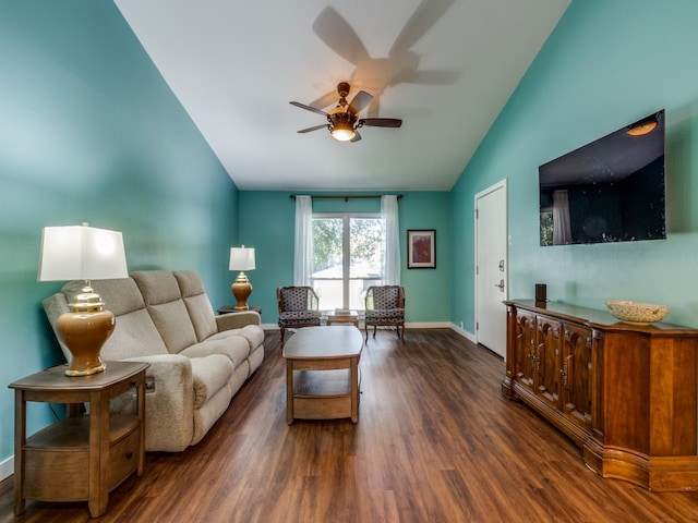 living room featuring vaulted ceiling, ceiling fan, and dark wood-type flooring