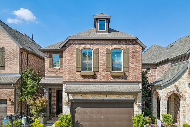 view of front of property with a garage