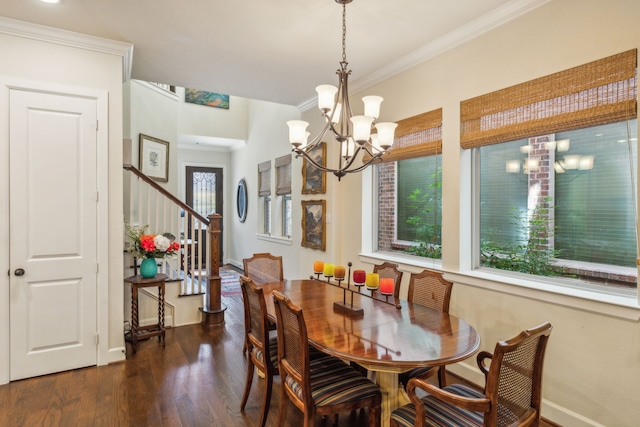 dining area with dark hardwood / wood-style floors, a chandelier, and crown molding