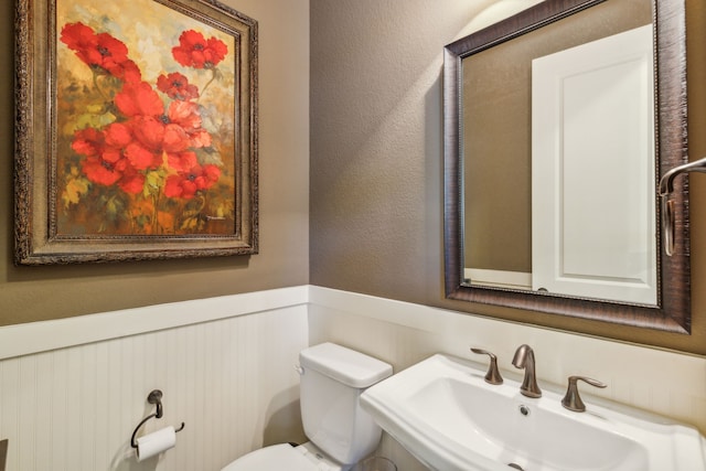 bathroom with toilet and sink