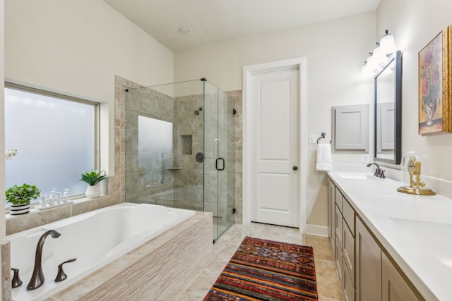 bathroom with tile patterned flooring, vanity, and separate shower and tub