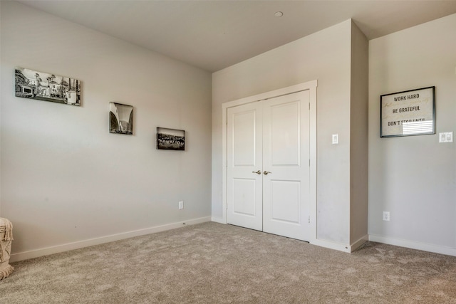 unfurnished bedroom with light carpet