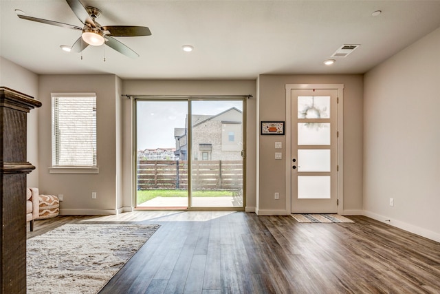 interior space featuring ceiling fan and dark wood-type flooring