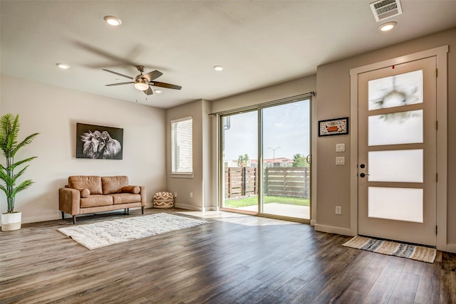 interior space featuring ceiling fan and dark hardwood / wood-style floors