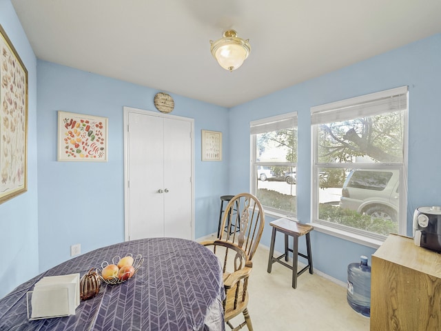 dining space with light carpet