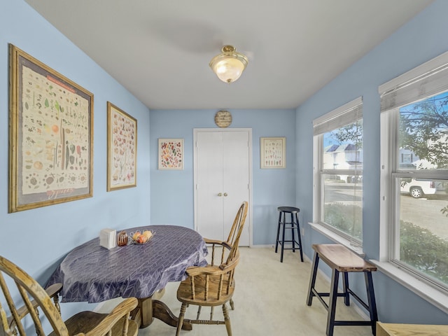 view of carpeted dining area