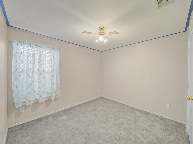 carpeted empty room with ceiling fan