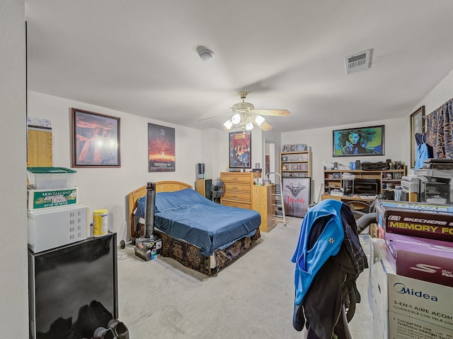 bedroom with ceiling fan and carpet floors