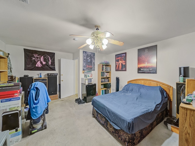 bedroom featuring ceiling fan and light colored carpet