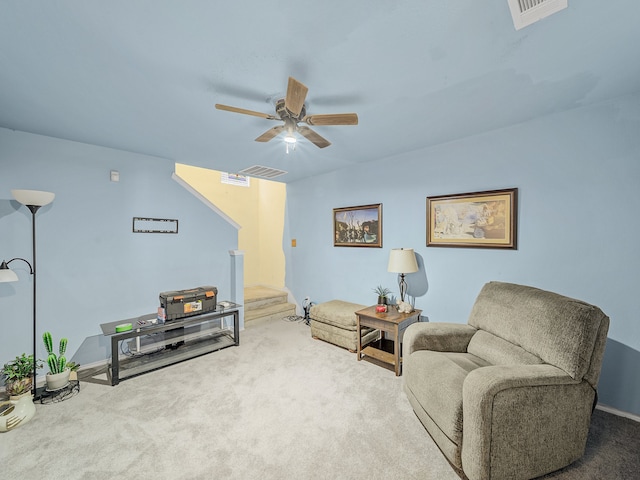 living area with carpet floors and ceiling fan