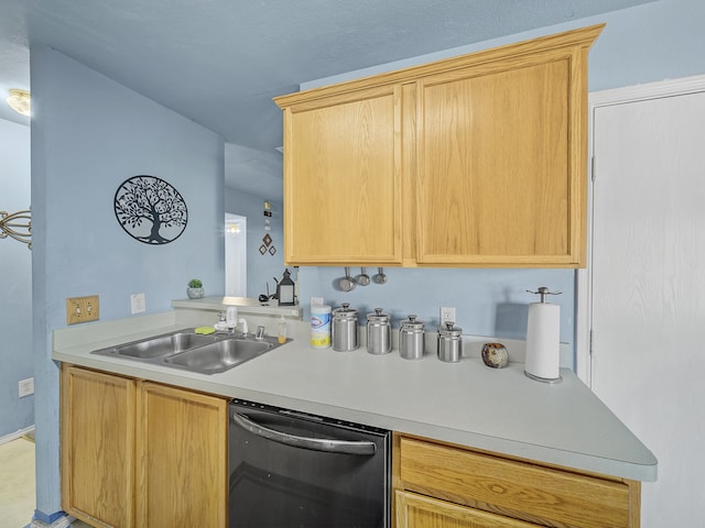 kitchen with black dishwasher, light brown cabinetry, and sink