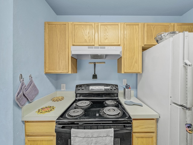 kitchen with white refrigerator, light brown cabinets, and black / electric stove