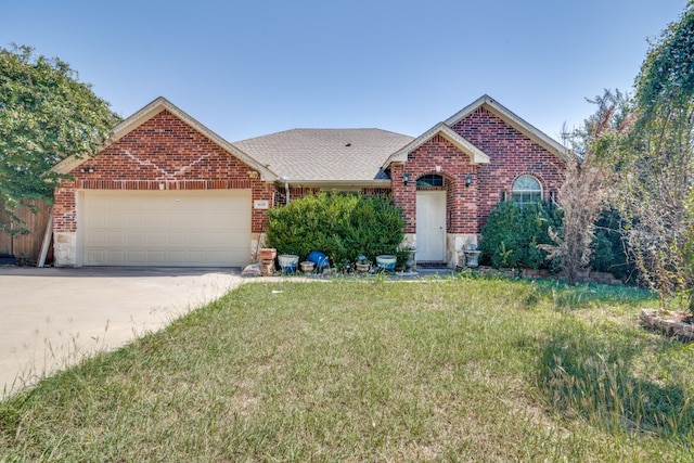 view of front property featuring a front yard and a garage