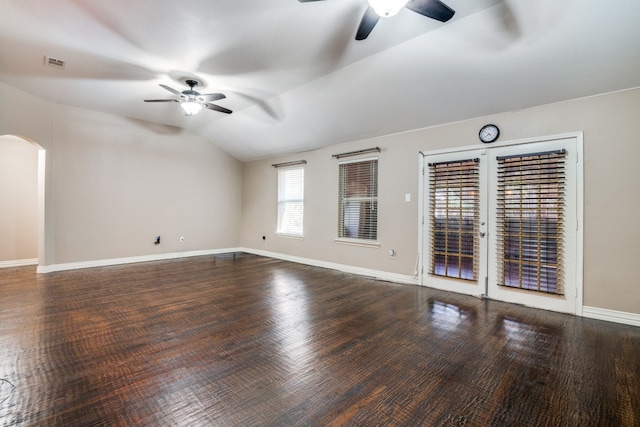 unfurnished room with vaulted ceiling, ceiling fan, and dark hardwood / wood-style floors