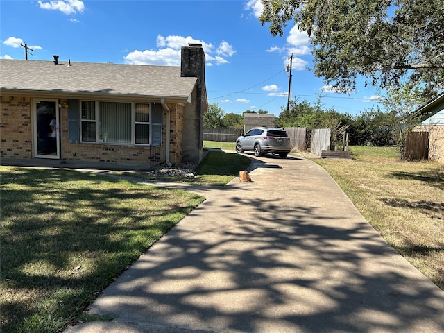 view of home's exterior with a lawn