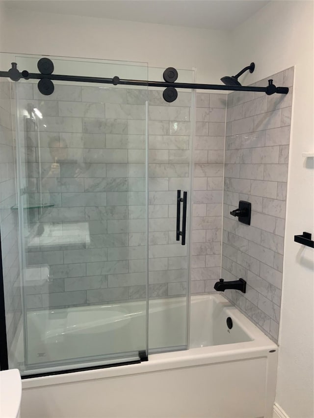 full bath featuring shower / bath combination with glass door