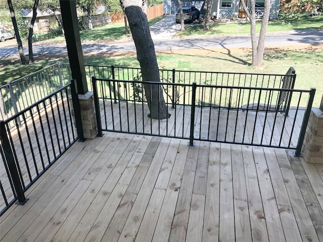 deck featuring a lawn