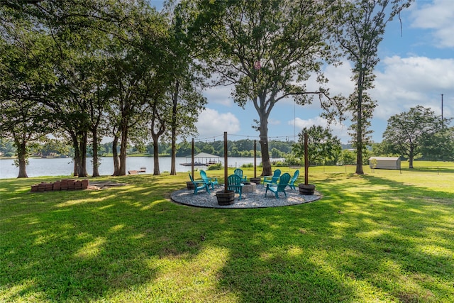 view of yard featuring a water view and a patio