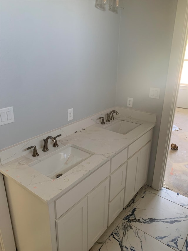 bathroom featuring a healthy amount of sunlight and vanity