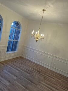 unfurnished dining area with a notable chandelier and dark hardwood / wood-style flooring