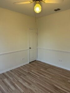 unfurnished room featuring dark hardwood / wood-style floors and ceiling fan