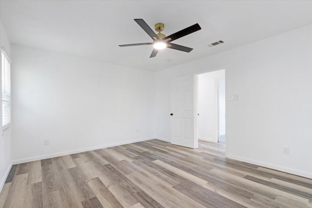 spare room with ceiling fan and light hardwood / wood-style flooring