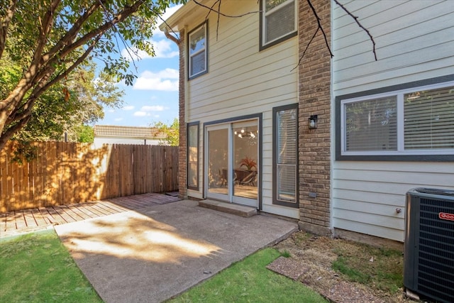 exterior space featuring cooling unit and a patio