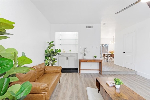 living room with light hardwood / wood-style floors