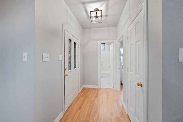 entryway with light hardwood / wood-style floors