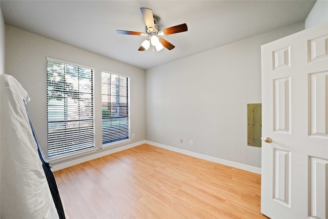 spare room featuring ceiling fan and light hardwood / wood-style flooring