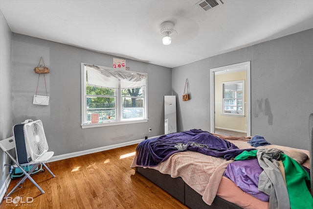 bedroom featuring ceiling fan and hardwood / wood-style flooring