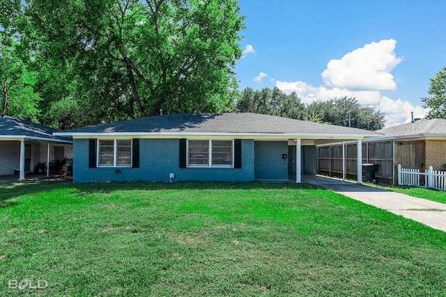 ranch-style home featuring a front yard