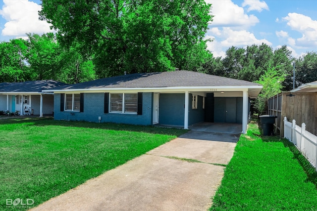 ranch-style home with a carport and a front yard