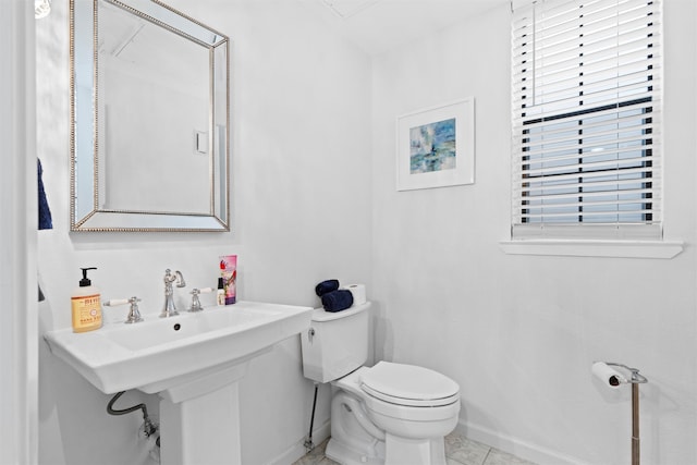 bathroom featuring tile patterned floors and toilet