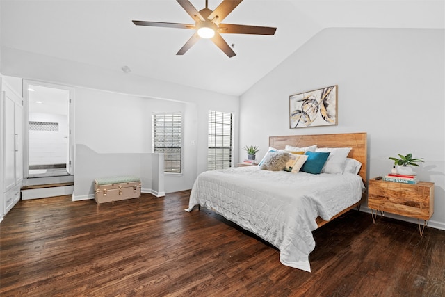 bedroom featuring dark hardwood / wood-style flooring, ceiling fan, and lofted ceiling